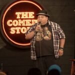 Victor Paz Jr on stage at a Comedy Store La Jolla show for Tony Calabrese