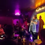 Victor Paz Jr performing at the Yellow Door comedy club